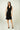 Magasinez la robe portefeuille sans manches de Colori - Shop the sleeveless wrap dress from Colori