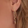 Magasinez les boucles d'oreilles dorées design fluide de Colori - Shop flowing gold design earrings from Colori