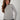 Magasinez le chandail torsadé à col rond de Colori - Shop the cable-knit crew neck sweater from Colori
